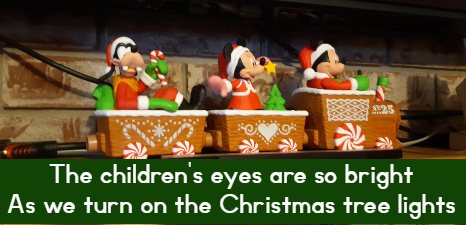 The children's eyes are so bright As we turn on the Christmas tree lights